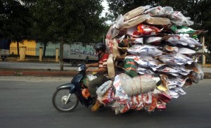 Vietnamese Man with Cumbersome Items On The top 2014 Most Bizarre Photos