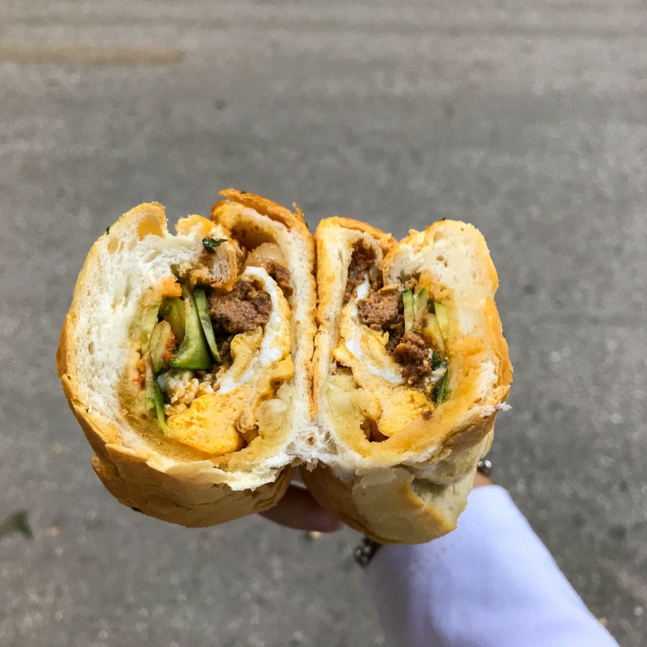 Banh Mi with fried egg and pate paste as topping